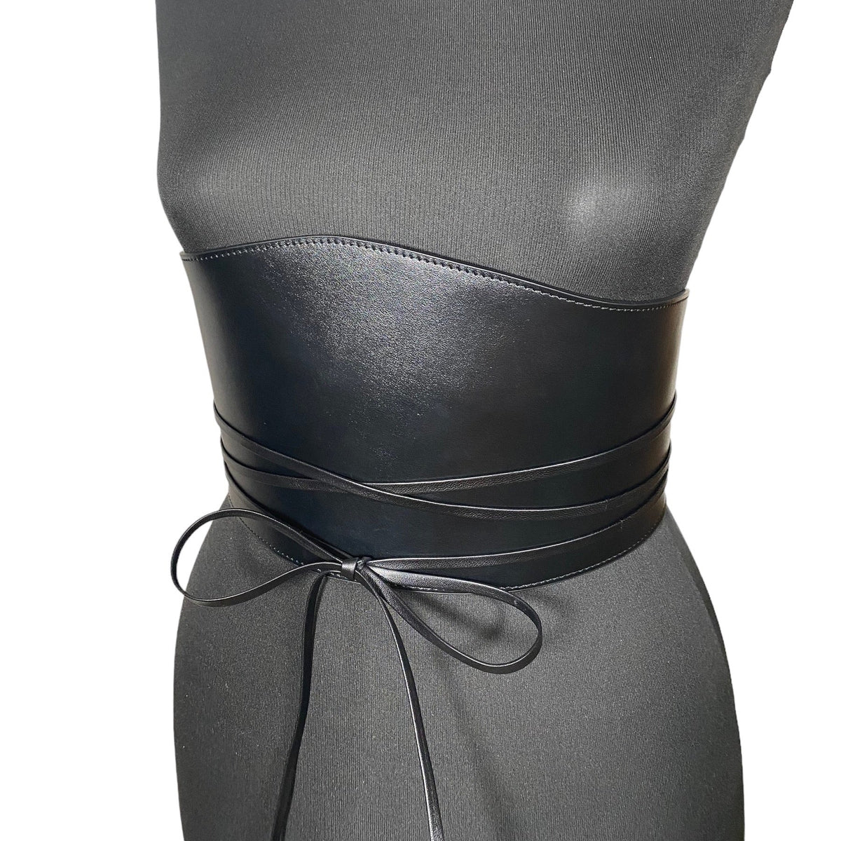Aria Margo black Italian leather under-bust belt with wrap-around cord ties on a mannequin torso.