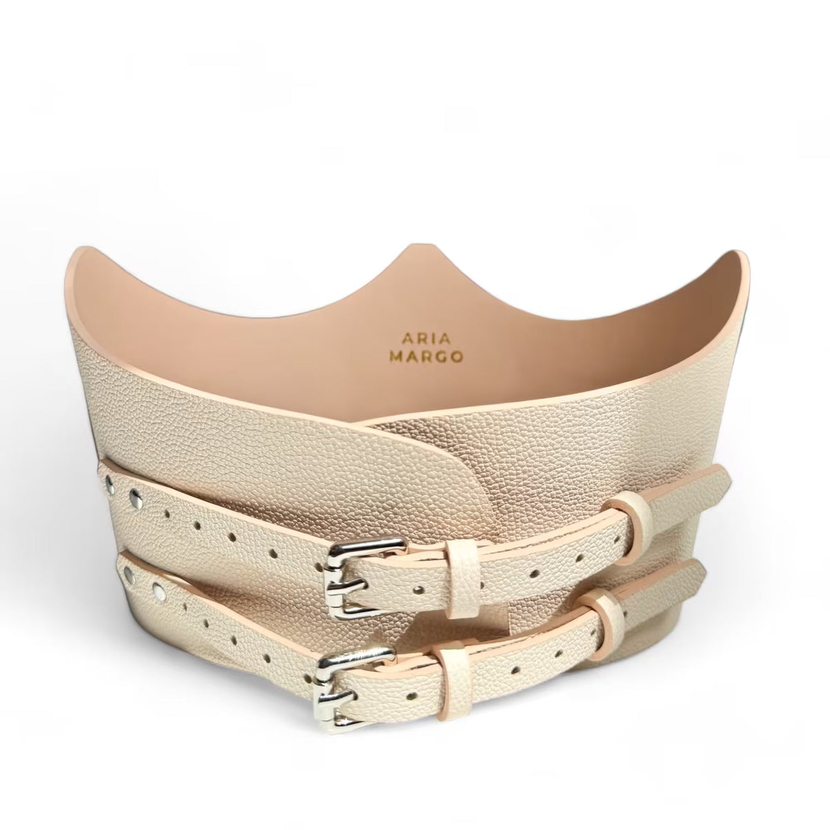 Aria Margo beige Italian leather under-bust belt with two adjustable silver buckles and a sculpted crown shape.