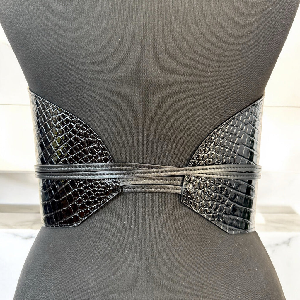Aria Margo black croc-embossed leather waist belt with wrap-around cord lacing on a mannequin torso.