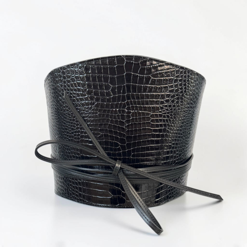 Aria Margo black croc-embossed leather waist belt with a wrap-around cord tie and structured silhouette.