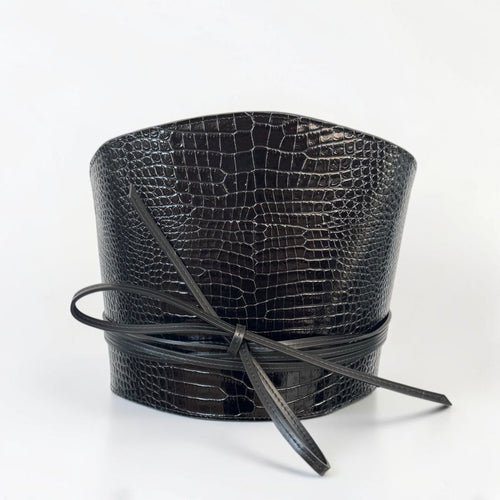 Aria Margo black croc-embossed leather waist belt with a wrap-around cord tie and structured silhouette.