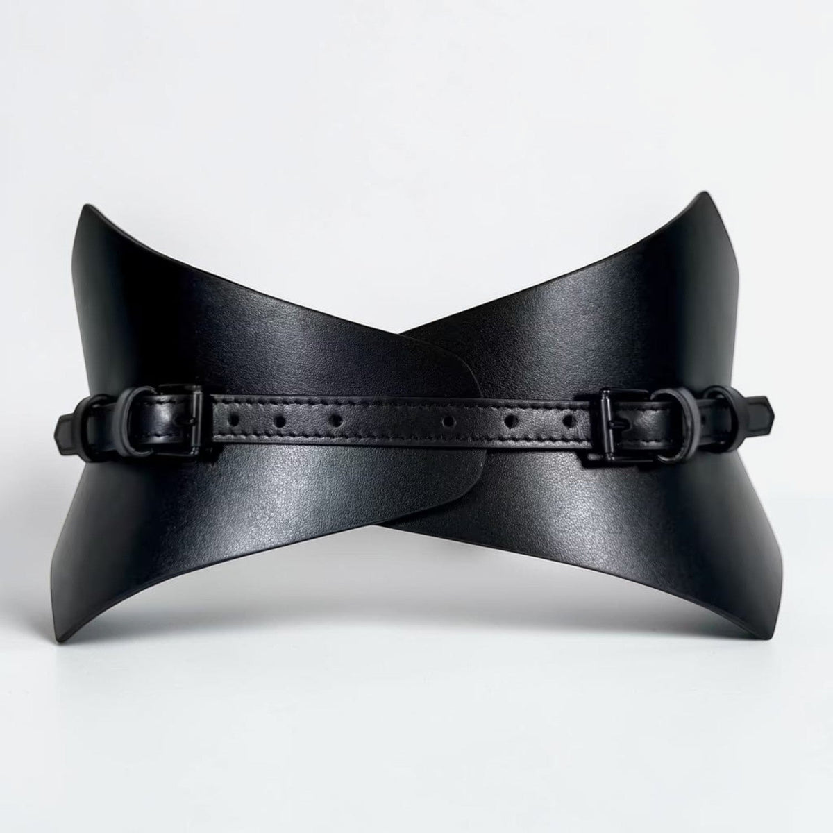 Aria Margo black leather corset belt with a pointed silhouette and dual buckle straps for waist definition.