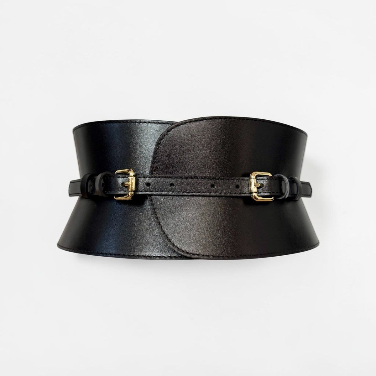 Aria Margo black leather V-cut corset belt with gold buckles, featuring a reversible minimalist design.