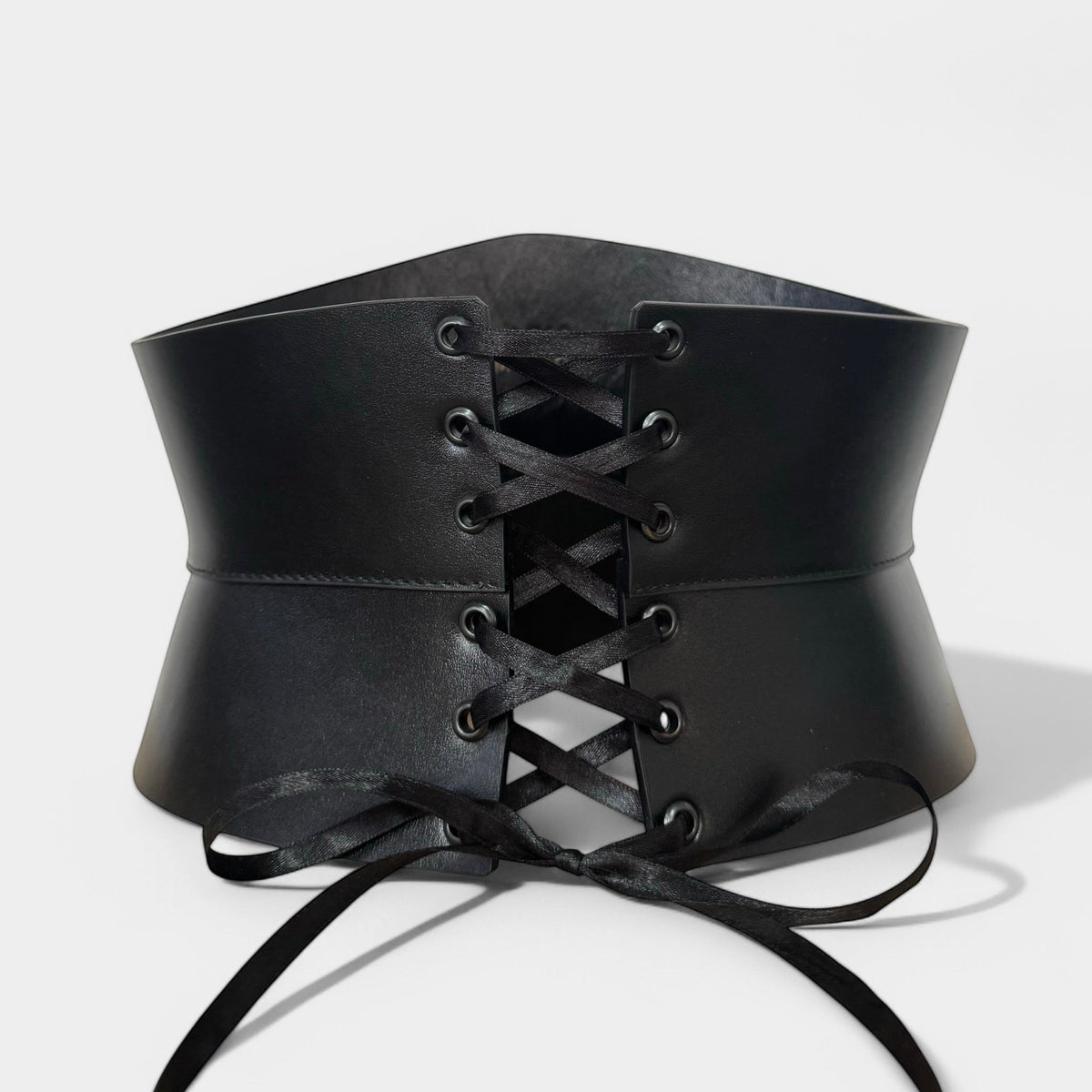 Aria Margo black Italian leather corset belt with an hourglass silhouette and satin lace-up front closure.
