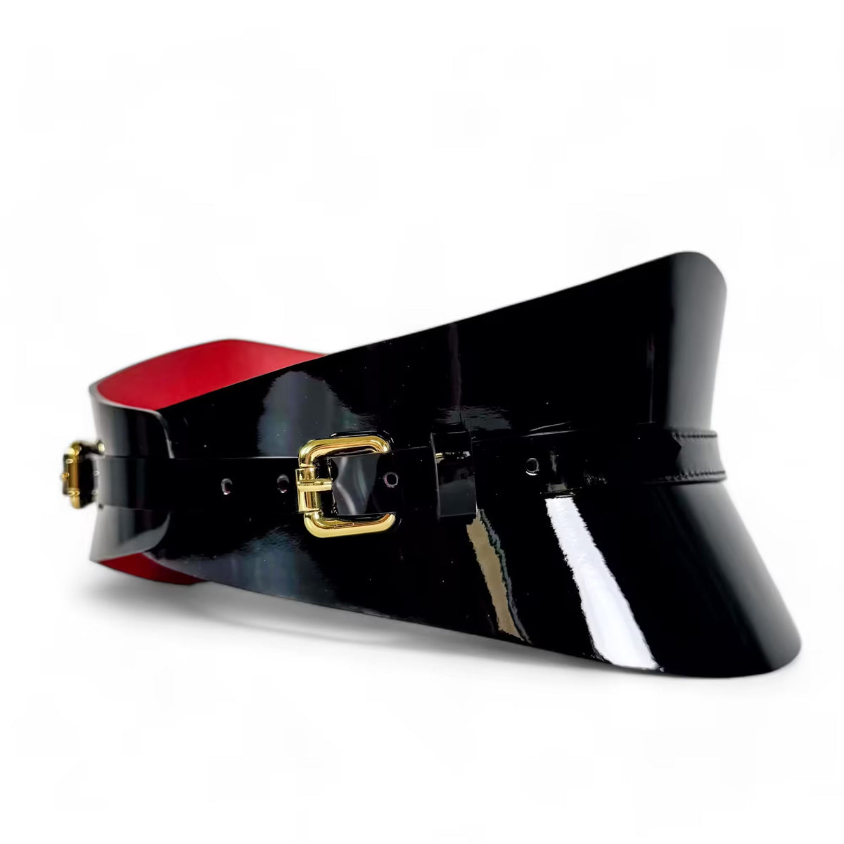 Aria Margo slim black patent leather corset belt with a high-shine finish, gold buckle, and red interior lining.