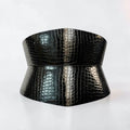 Aria Margo black patent croc-embossed leather corset belt with an hourglass silhouette and glossy finish.