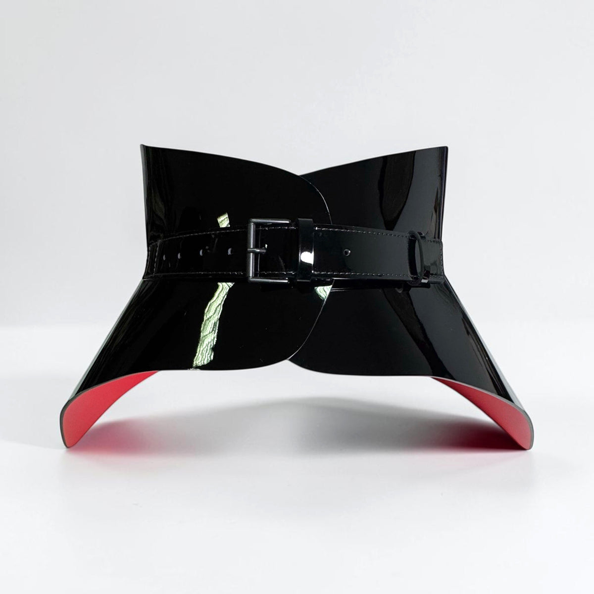 Aria Margo Hallo black patent leather corset belt with a high-shine finish, buckle closure, and red lining.