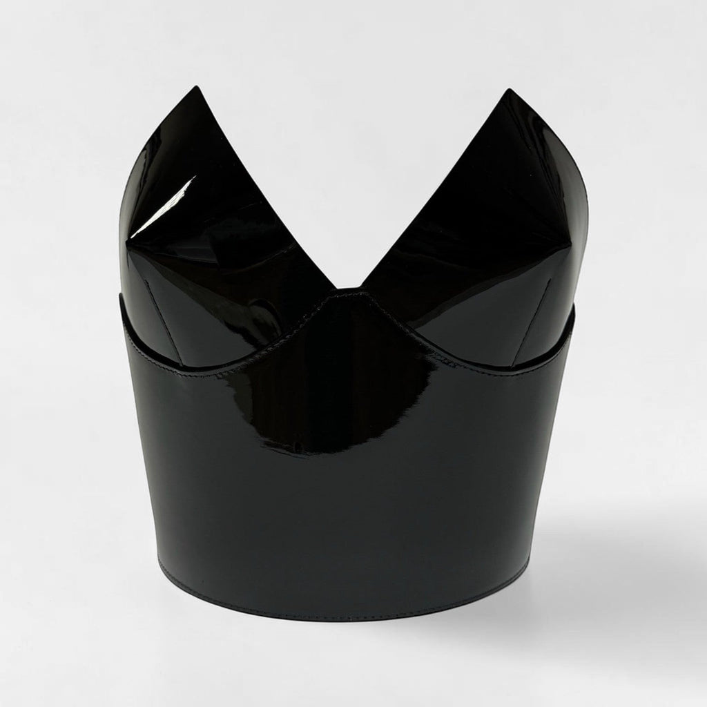 Aria Margo black patent leather over-bust corset with a structured, high-shine finish and sculptural neckline.