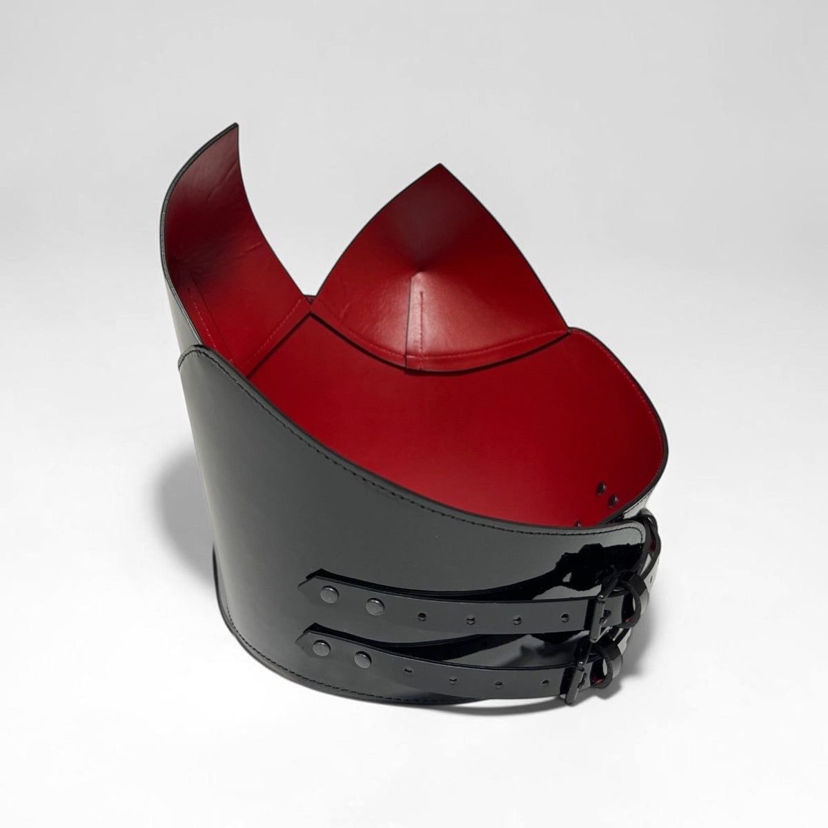 Aria Margo black patent leather over-bust corset with a striking red interior lining and adjustable back buckles.