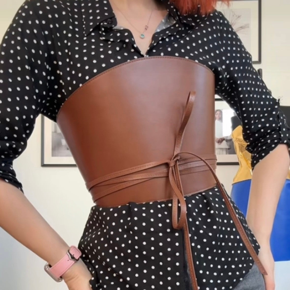 Aria Margo brown Italian leather corset belt with wrap-around cord ties worn over a black polka dot shirt.