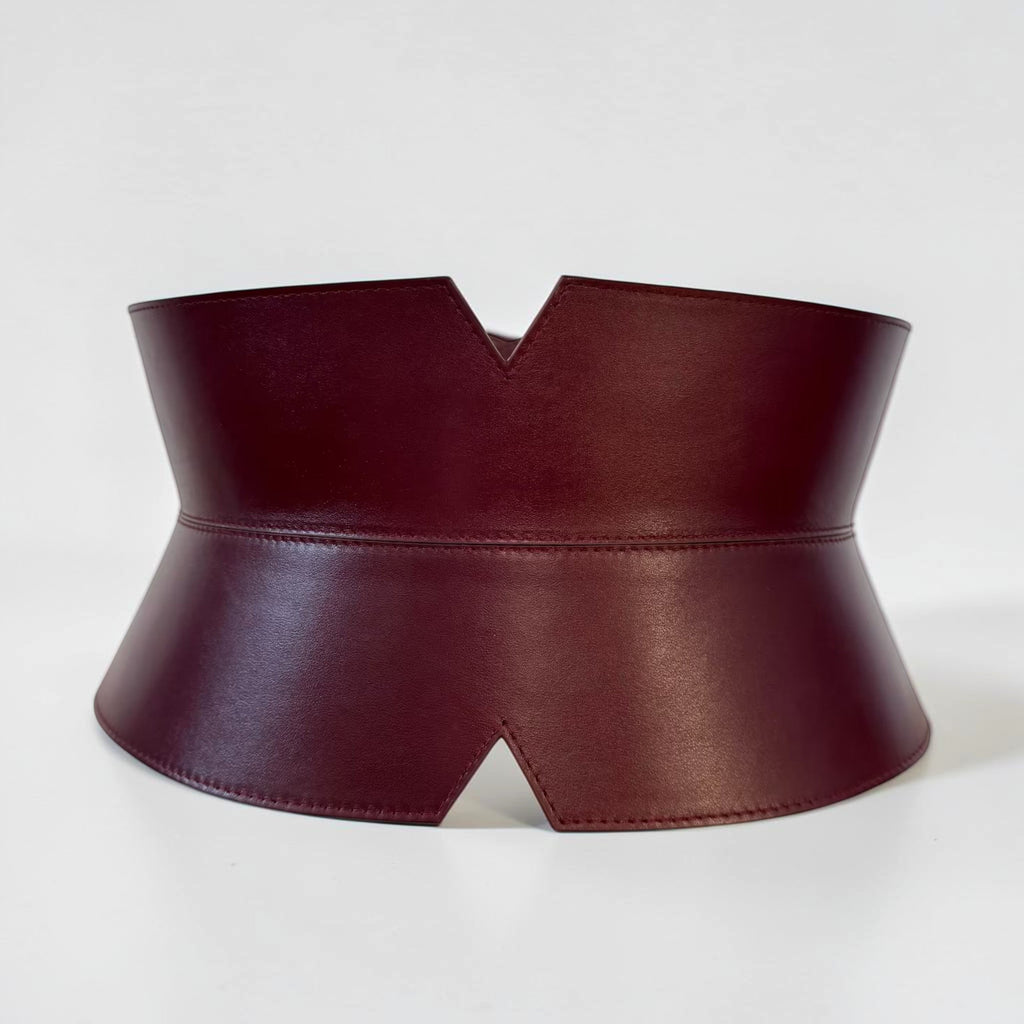 Aria Margo burgundy leather V-cut corset belt with an hourglass silhouette and stitched edge detailing.