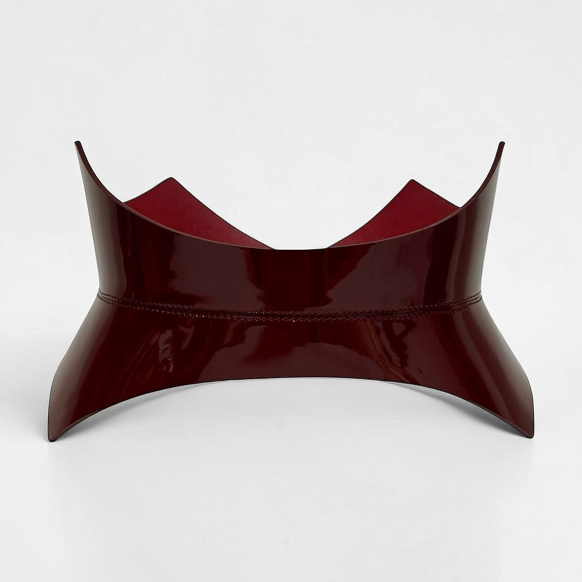 Aria Margo burgundy Italian leather corset belt with a pointed, structured silhouette for waist definition.