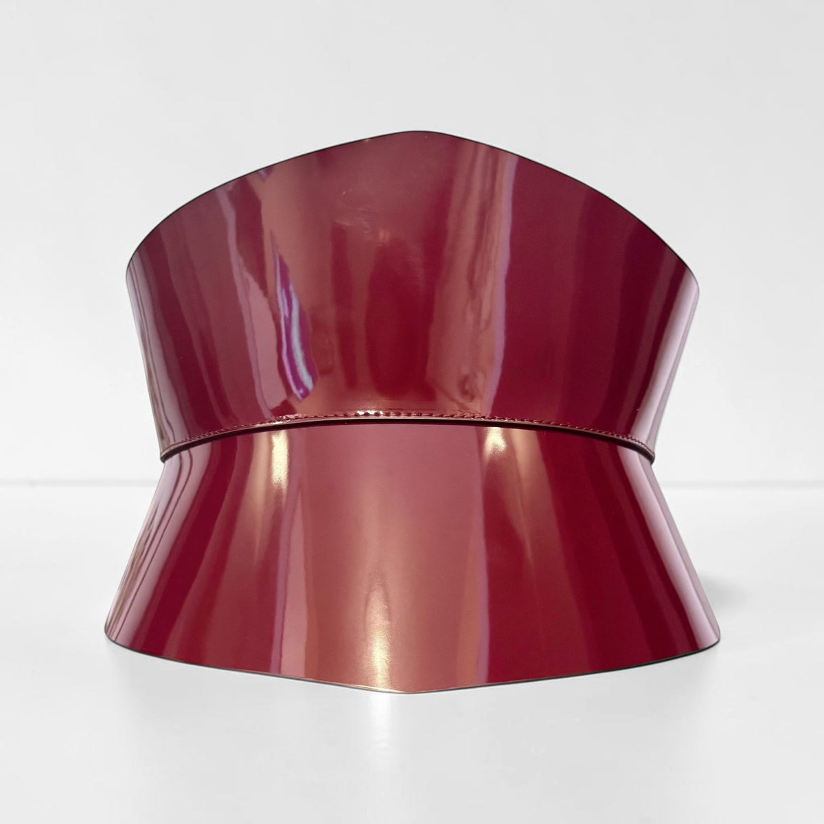 Aria Margo burgundy Italian leather corset belt with an hourglass silhouette and glossy finish.