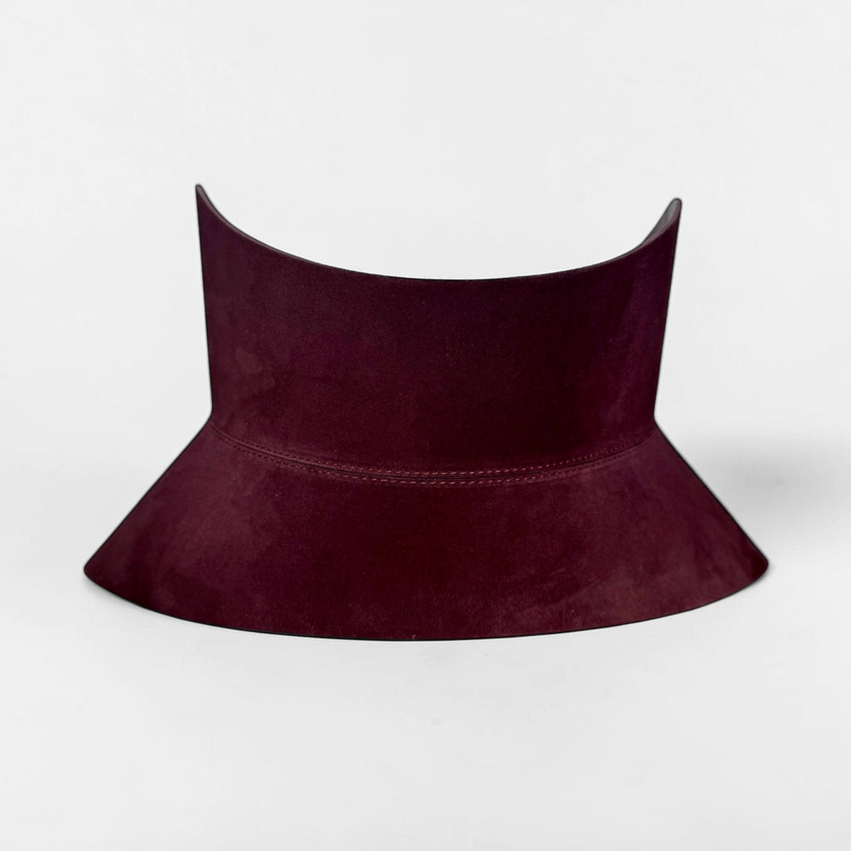 Aria Margo burgundy suede corset belt with a dramatic hourglass shape and soft matte texture.