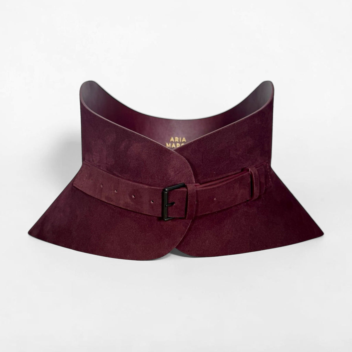 Aria Margo burgundy suede corset belt with a black buckle and structured hourglass silhouette.