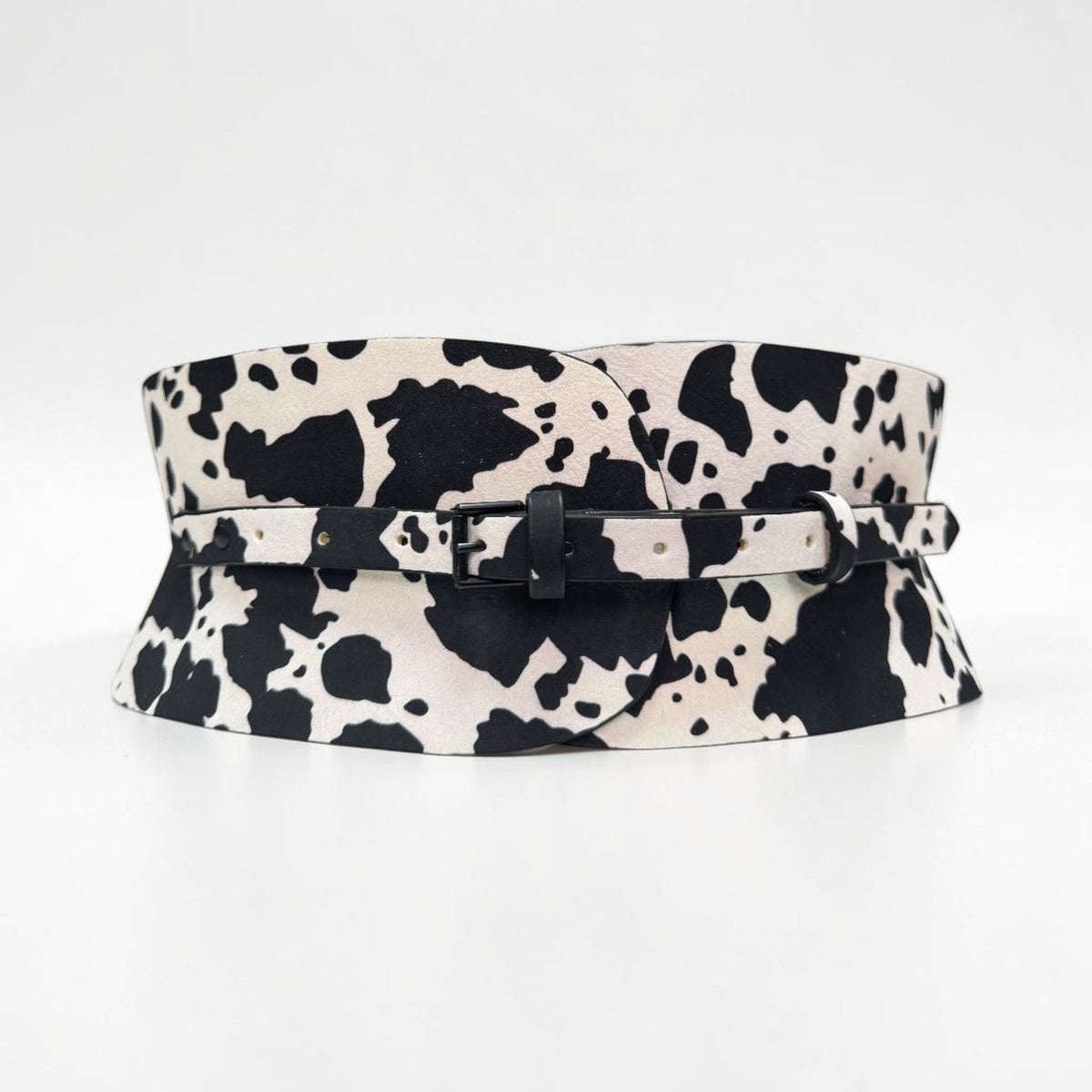 Aria Margo cow print leather corset belt with a black buckle and adjustable strap.