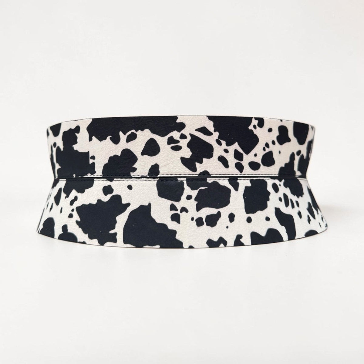 Aria Margo Sculpt corset belt in black and white cow print pony-hair leather with a structured waist design.