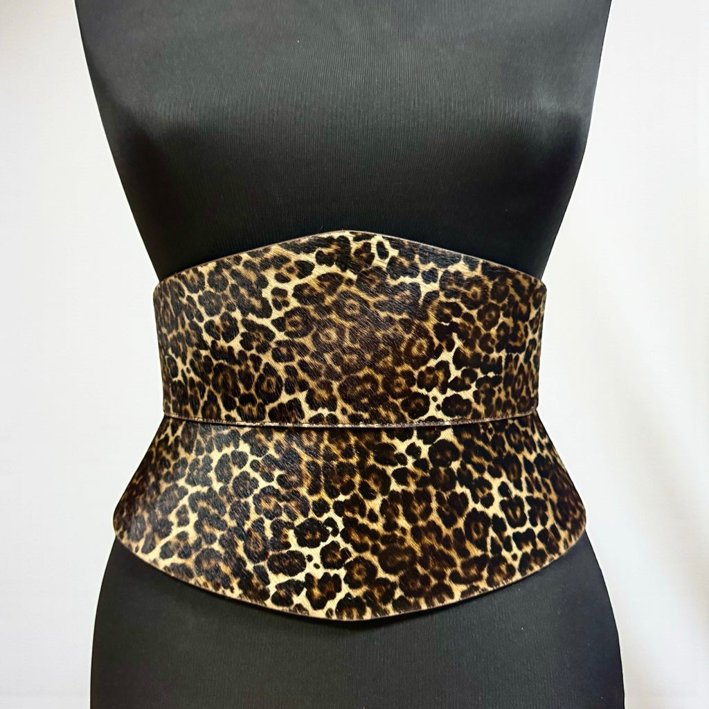 Aria Margo Eclipse corset belt in leopard print pony-hair leather with an hourglass silhouette on a mannequin.