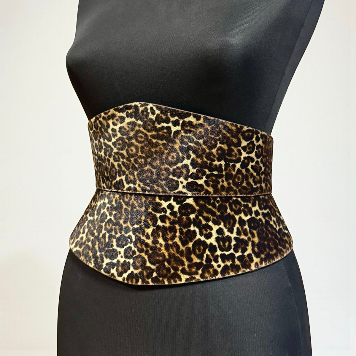 Aria Margo Eclipse leather corset belt in leopard print pony hair with an hourglass silhouette on a mannequin