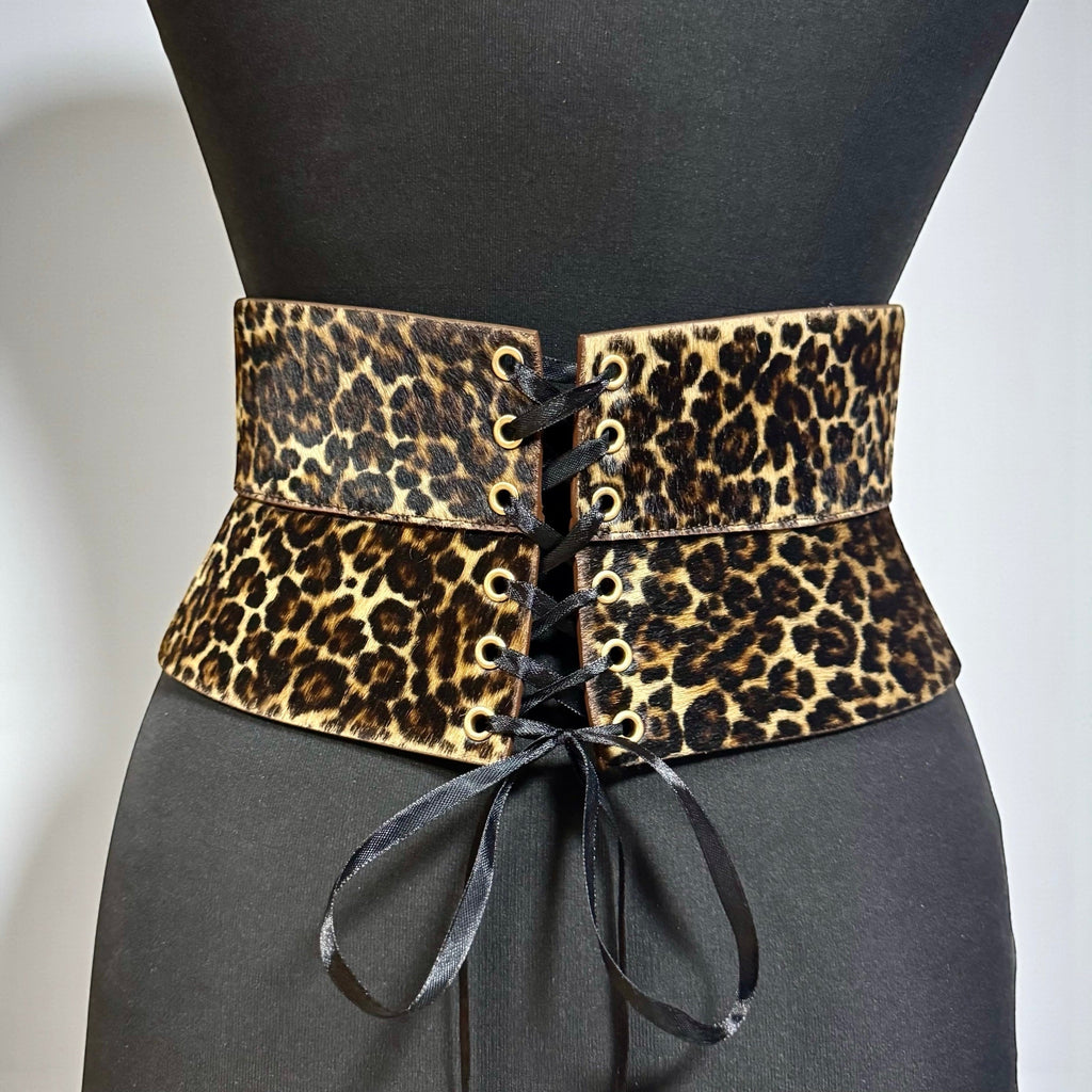 Aria Margo leopard print pony-hair leather corset belt with black satin lace-up front on a mannequin