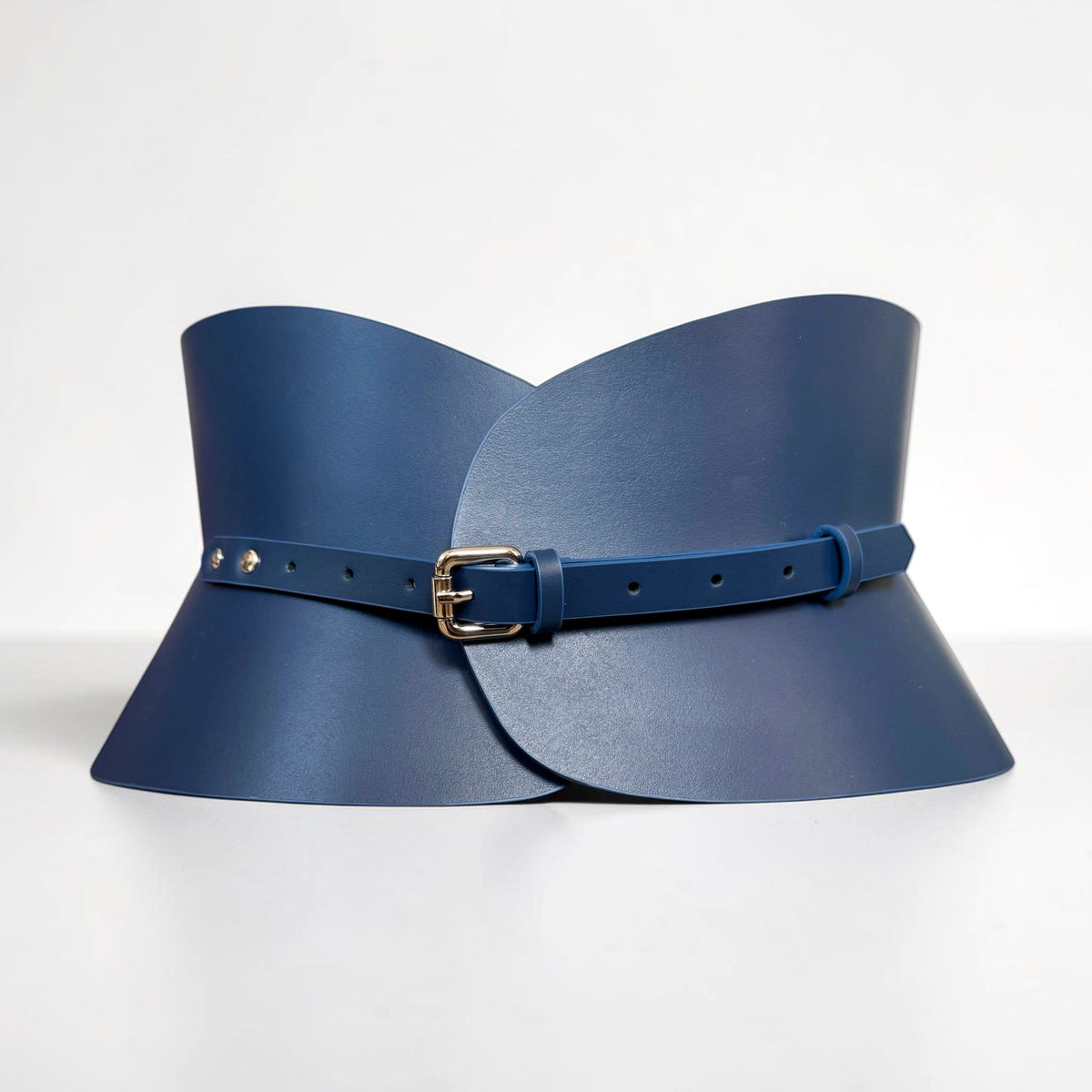 Aria Margo navy blue Italian leather hourglass corset belt with a gold-tone buckle on a light grey background.