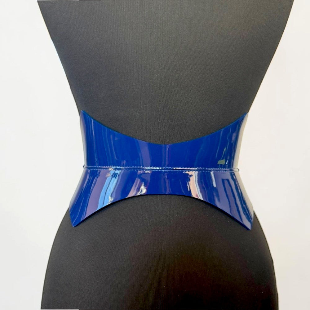 Aria Margo navy blue patent leather corset belt with a high-shine finish on a black mannequin torso.