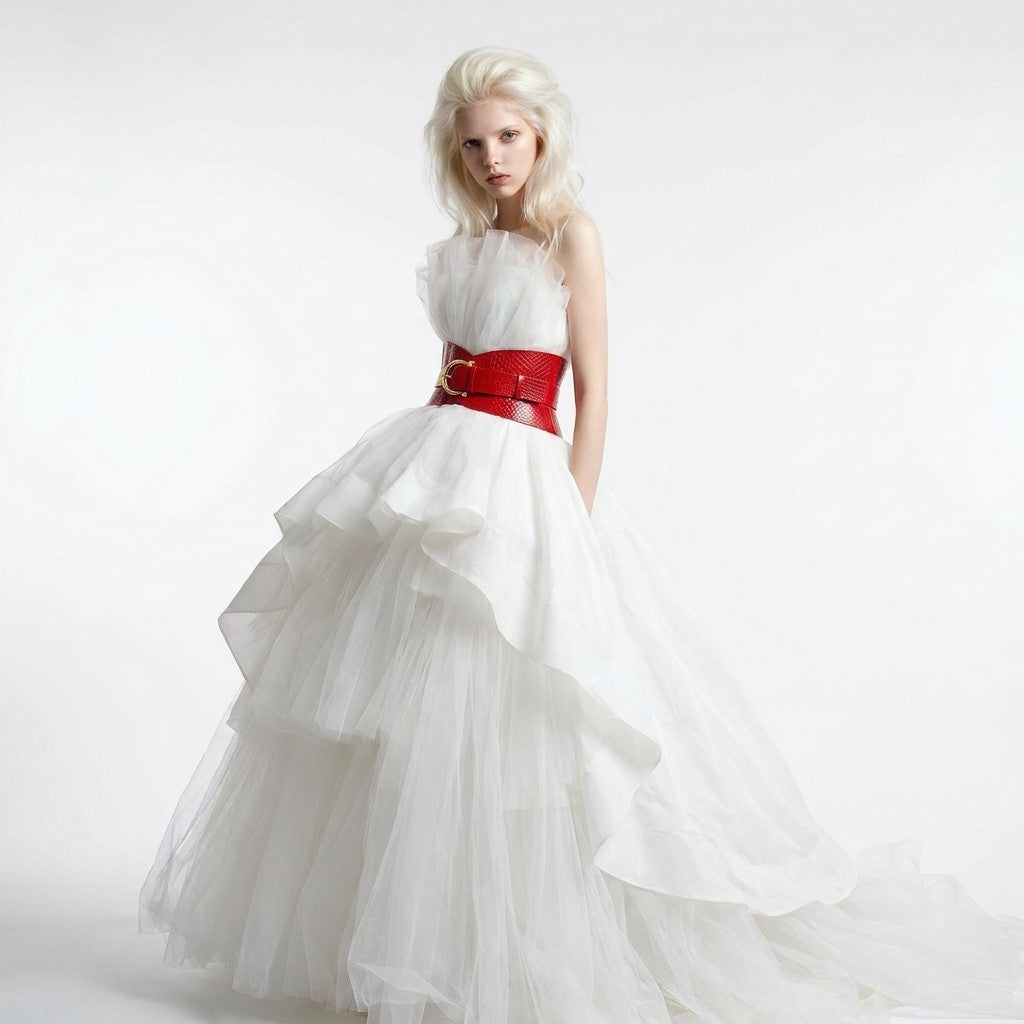 Aria Margo red croc-embossed leather corset belt worn by a model in a white tulle gown against a white background