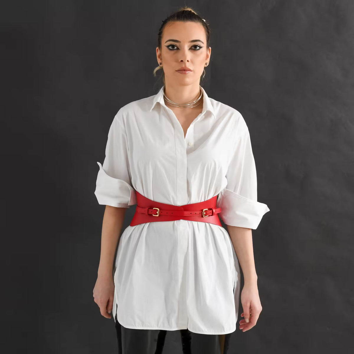 Aria Margo slim red Italian leather corset belt worn over a white button-down shirt for a structured waist