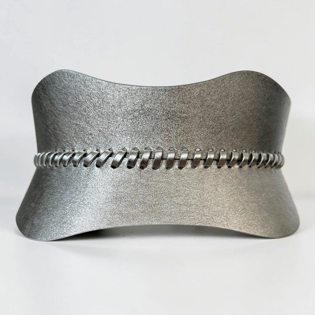 Aria Margo silver leather corset belt featuring hand-laced detailing and a metallic finish for a polished look.