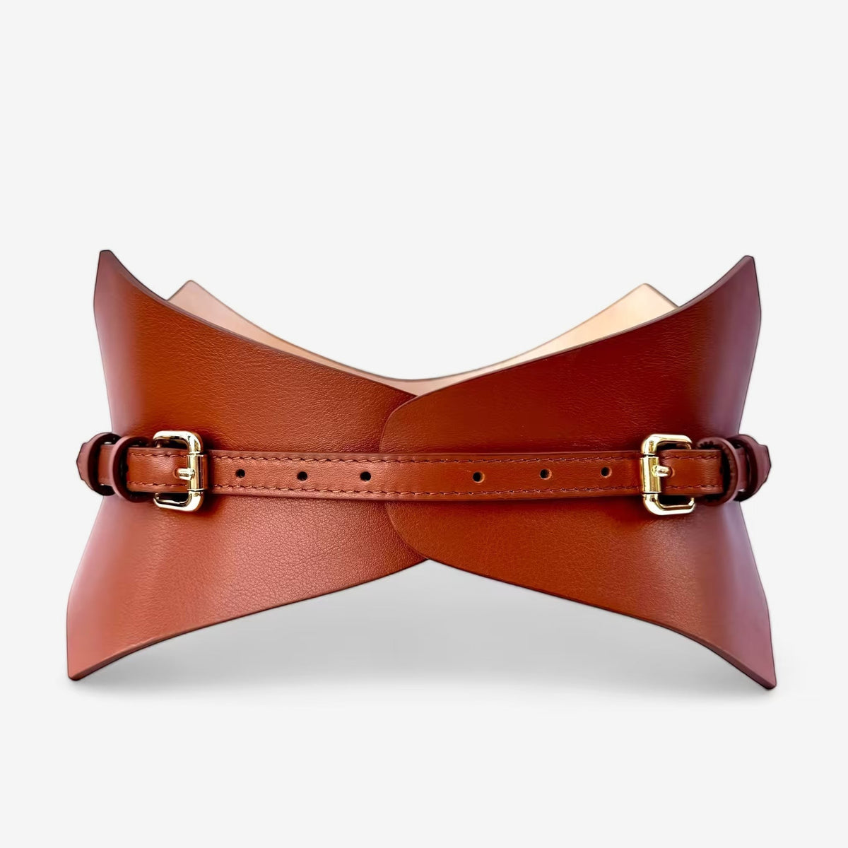 Aria Margo Test brown Italian leather corset belt with gold buckles and a pointed, structured waist-defining design.