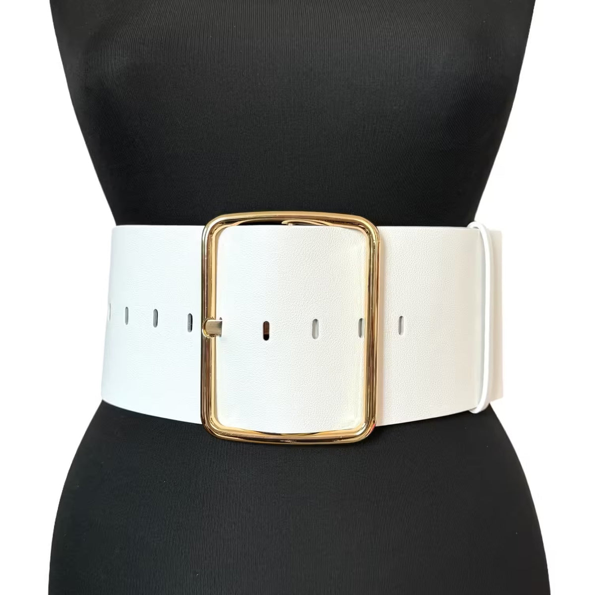 Aria Margo wide white Italian leather belt with a large gold-tone buckle worn over a black garment